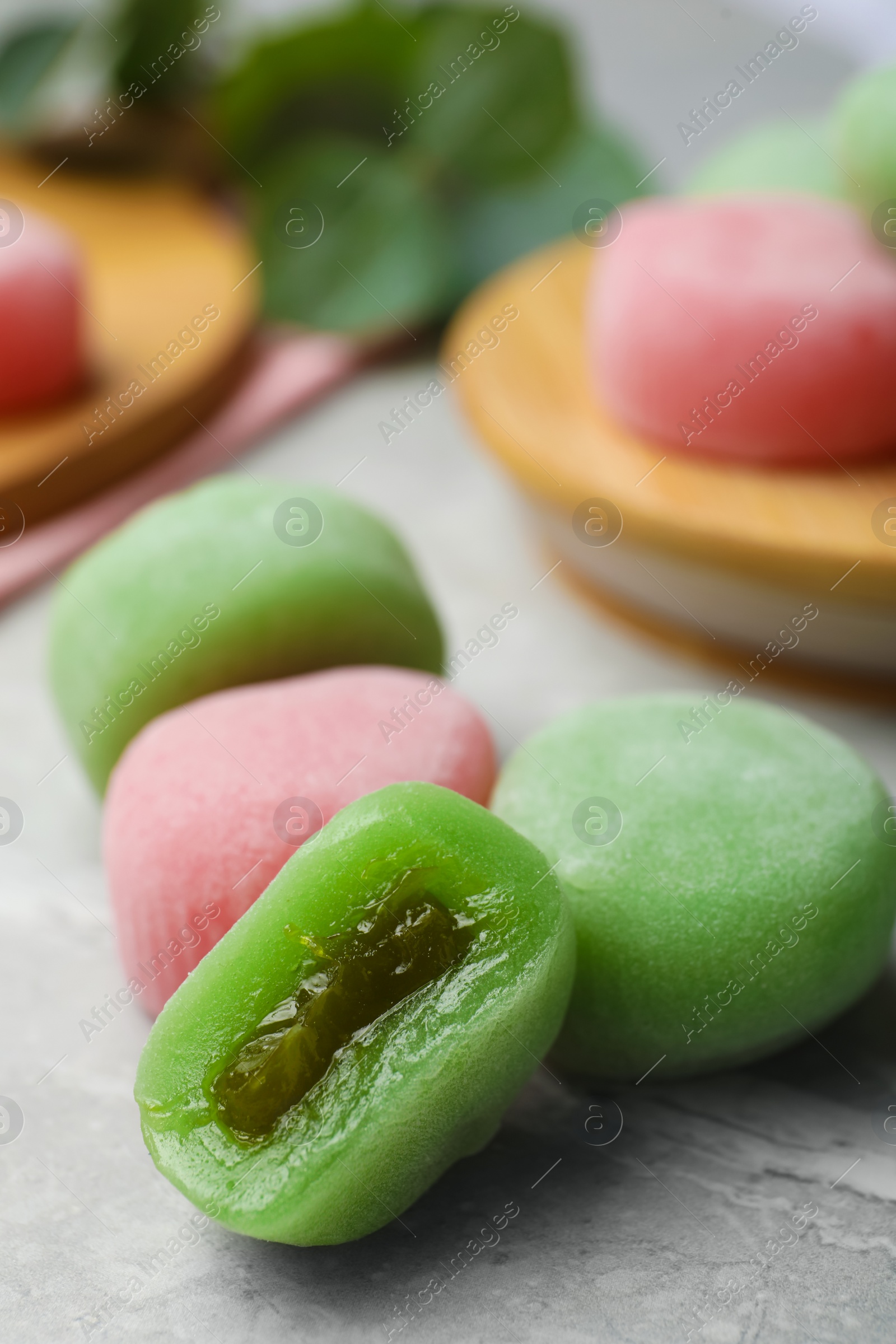 Photo of Many different delicious mochi on grey table. Traditional Japanese dessert