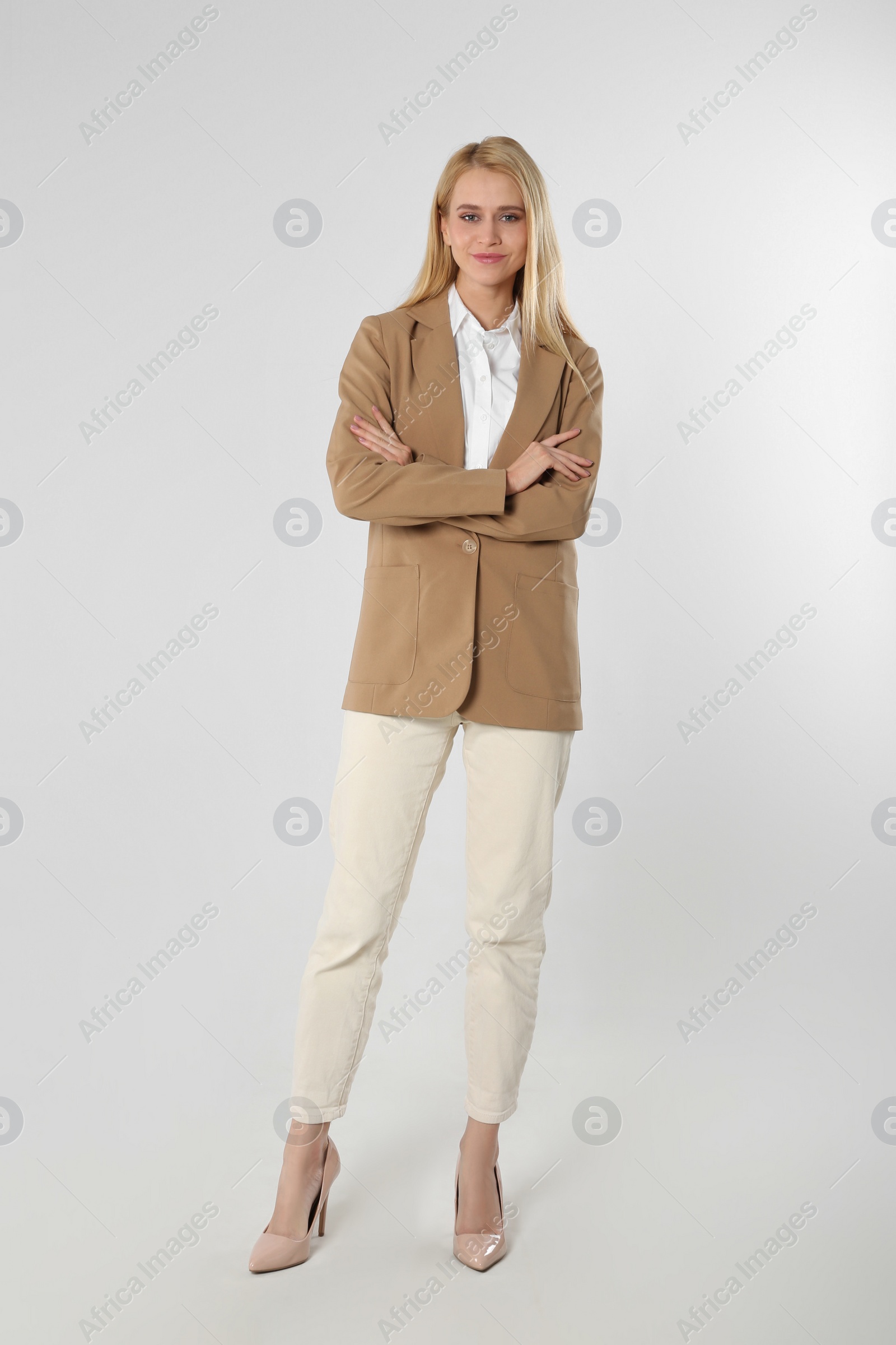 Photo of Full length portrait of young businesswoman on white background