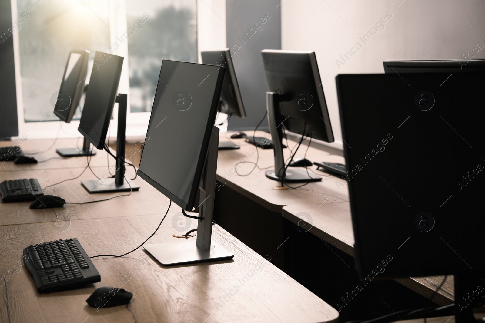 Photo of Many modern computers in open space office