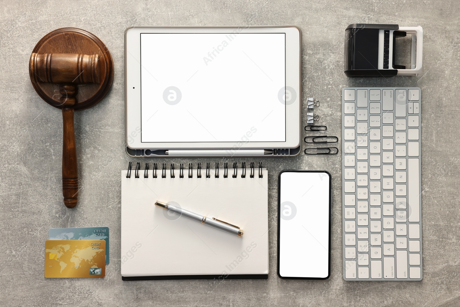 Photo of Flat lay composition with modern tablet on light gray textured table. Space for text