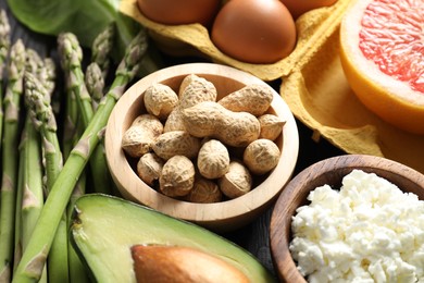 Photo of Nuts, cottage cheese, asparagus and other healthy food, closeup