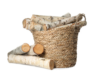 Wicker basket with cut firewood isolated on white