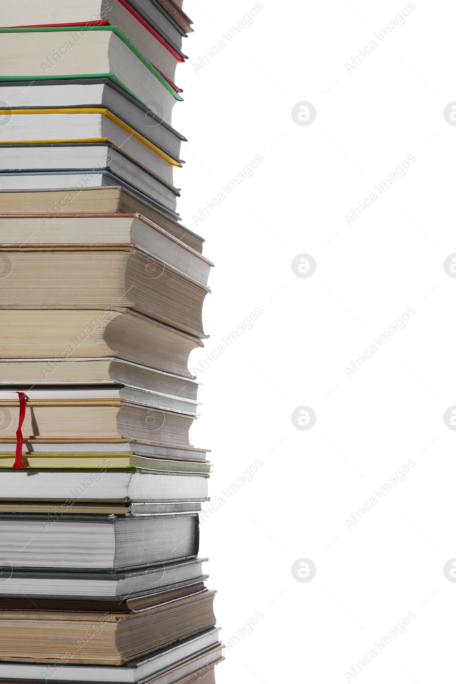 Photo of High stack of many different books isolated on white