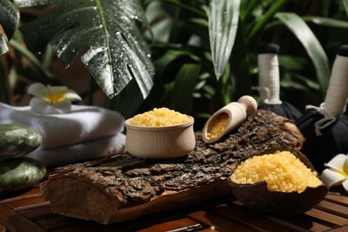 Photo of Spa composition with orange sea salt on wooden table