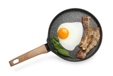Photo of Tasty cooked chicken egg with bacon in frying pan isolated on white, top view