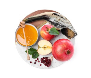 Photo of Honey, pomegranate, apples and shofar on white background, top view. Rosh Hashana holiday