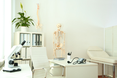 Photo of Interior of modern medical office. Doctor's workplace