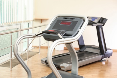 Gym interior with treadmills. Modern sport equipment