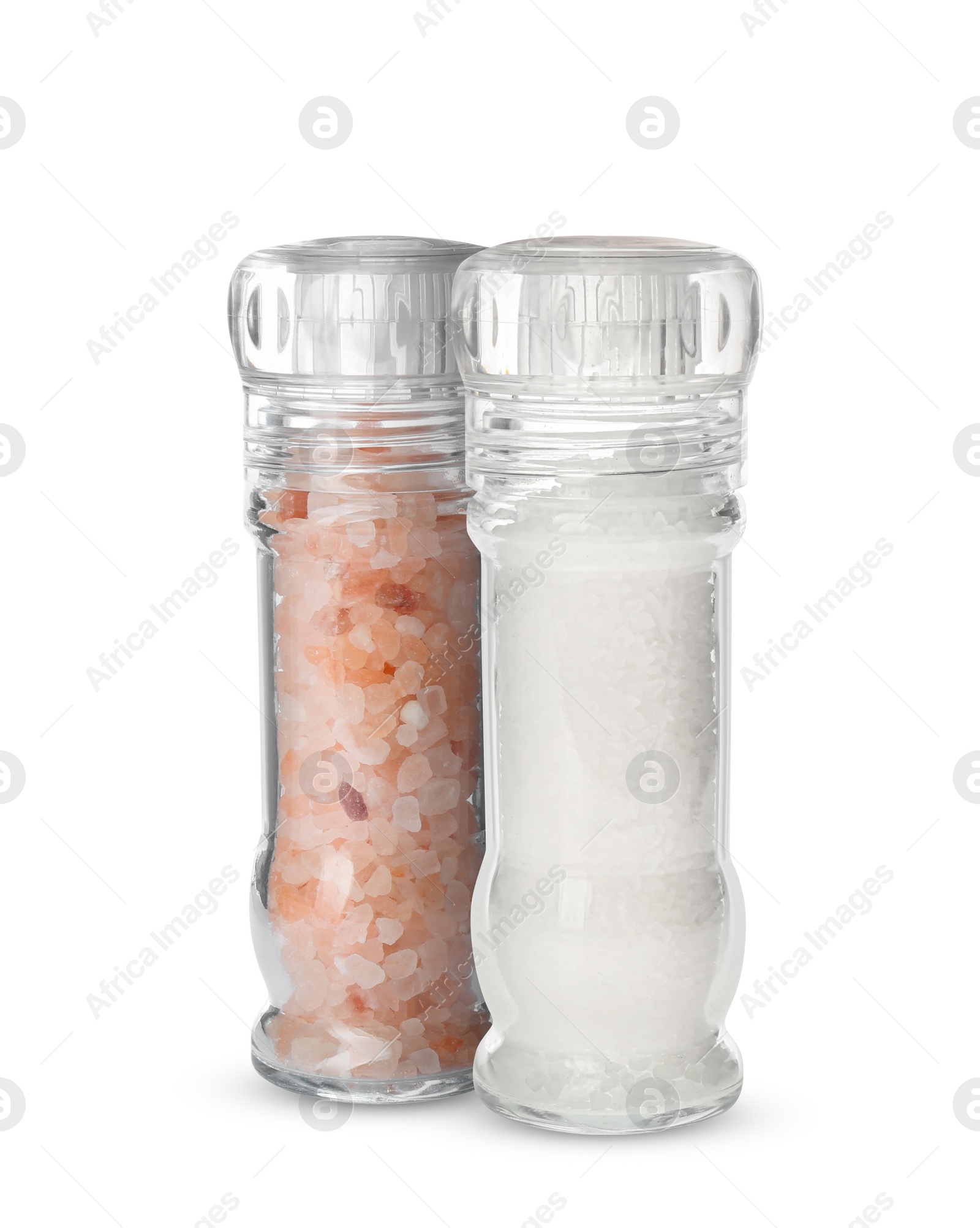 Image of Different salt in glass mill and shaker isolated on white