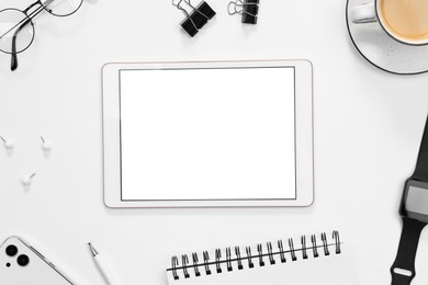 Photo of Flat lay composition with modern tablet on white background. Space for text