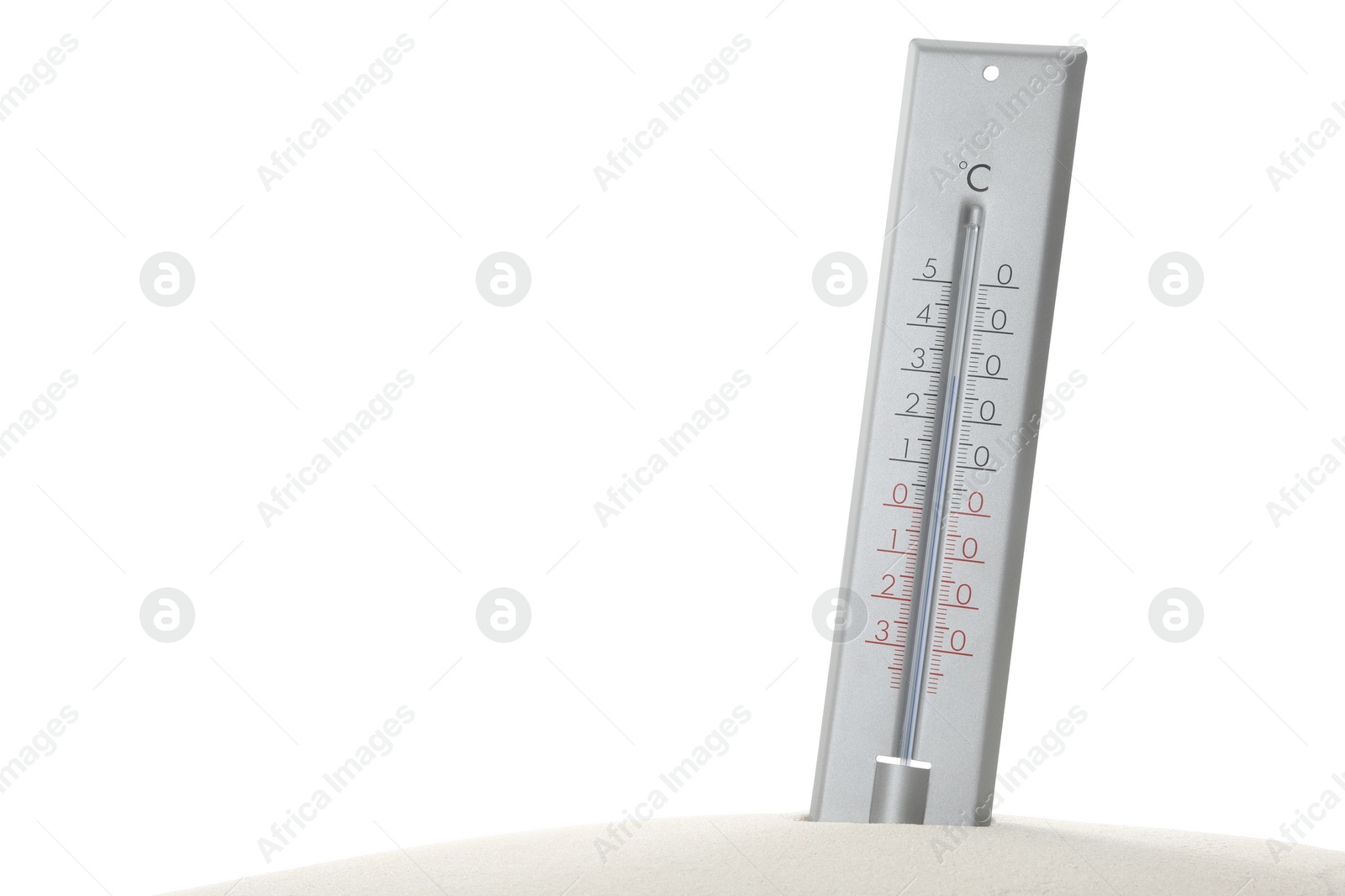 Photo of Weather thermometer in sand against white background