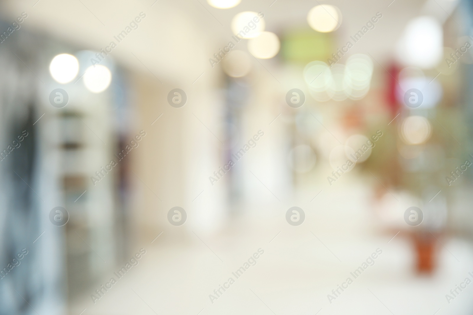 Photo of Blurred view of modern shopping mall interior