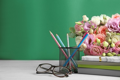 Composition with flowers and glasses for Teacher's day on white table