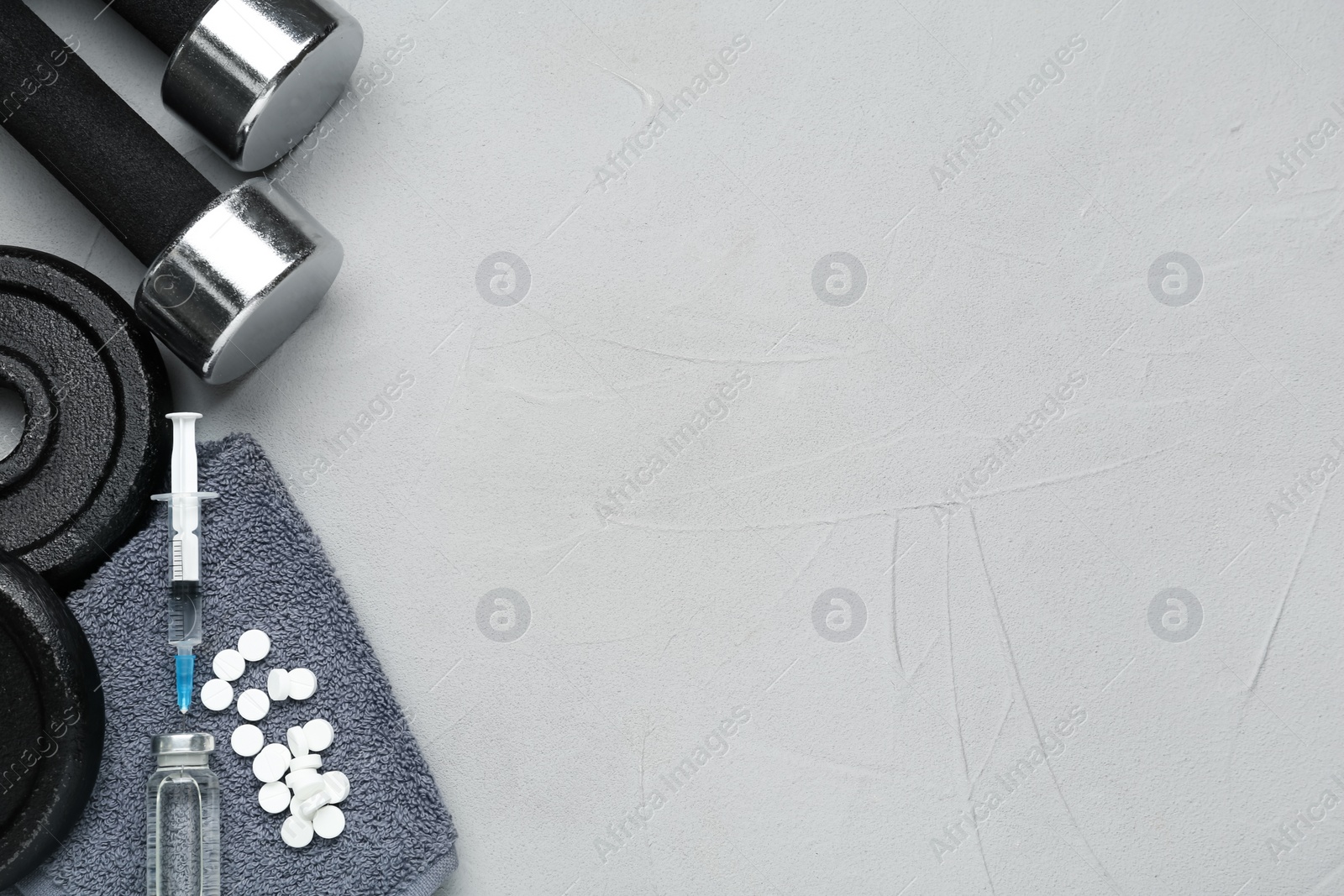 Photo of Different drugs and sports equipment on grey background, flat lay with space for text. Doping control