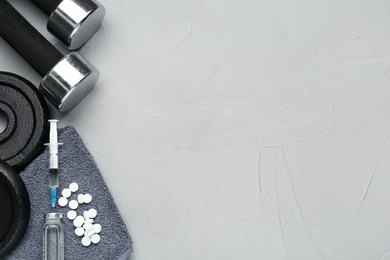 Photo of Different drugs and sports equipment on grey background, flat lay with space for text. Doping control