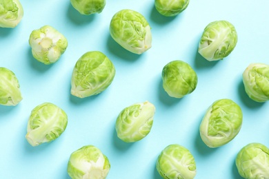 Fresh Brussels sprouts on color background, flat lay