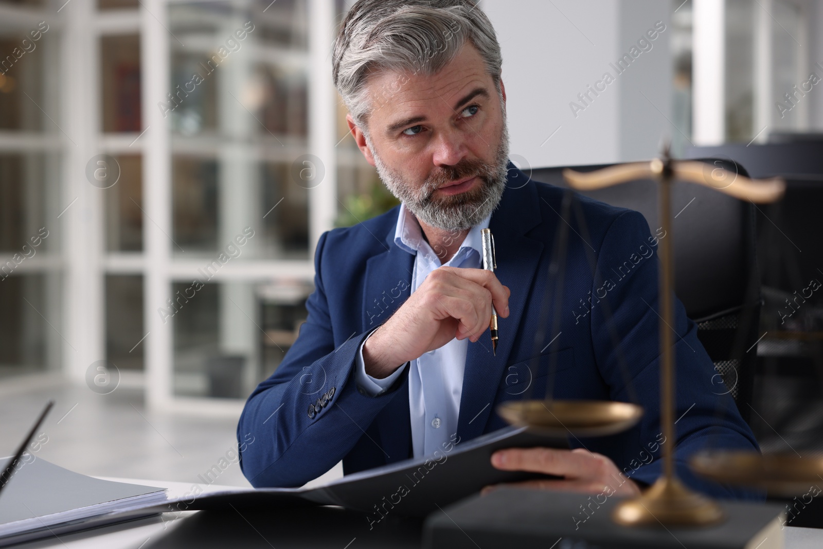 Photo of Portrait of handsome lawyer in office, space for text