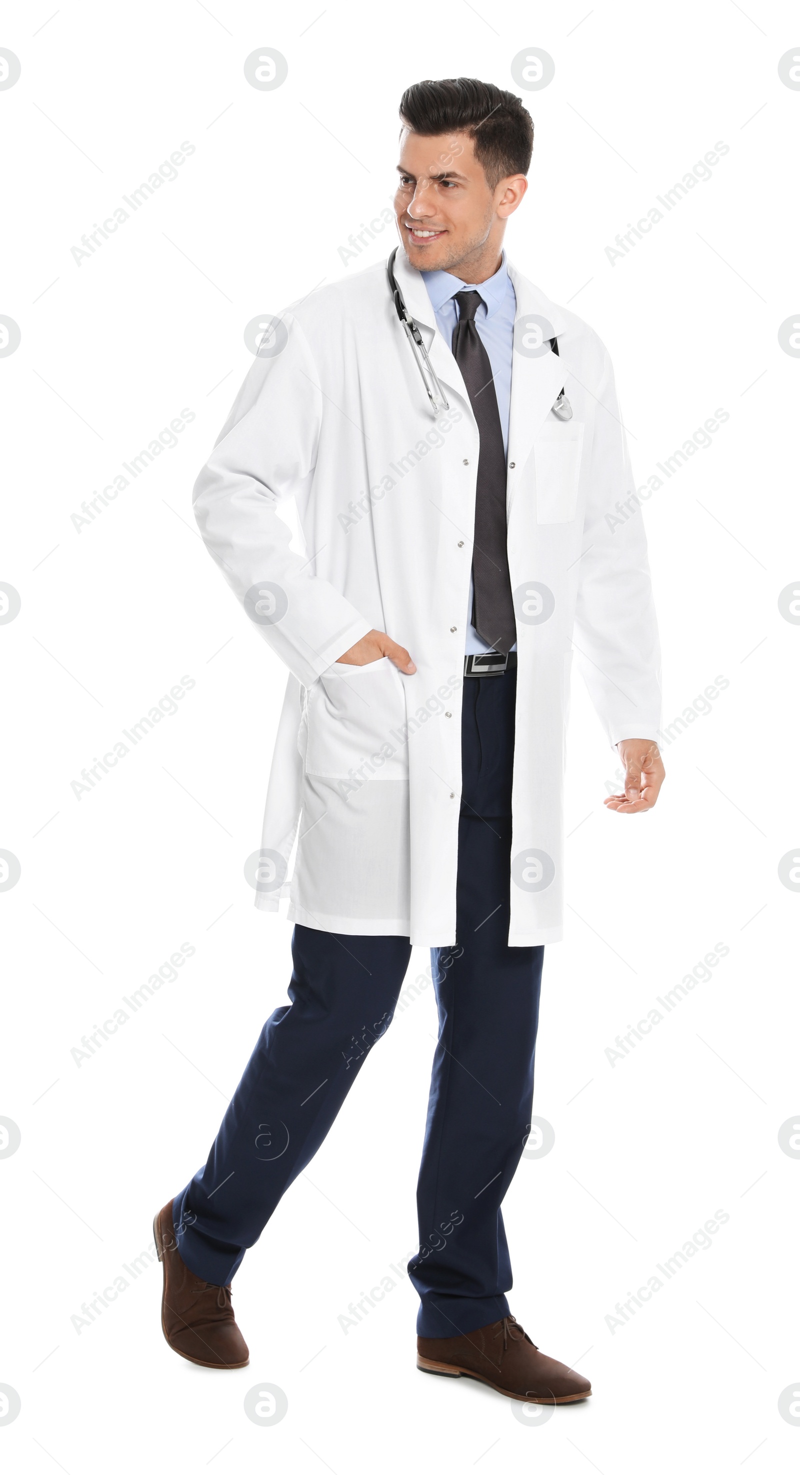 Photo of Full length portrait of medical doctor with stethoscope isolated on white