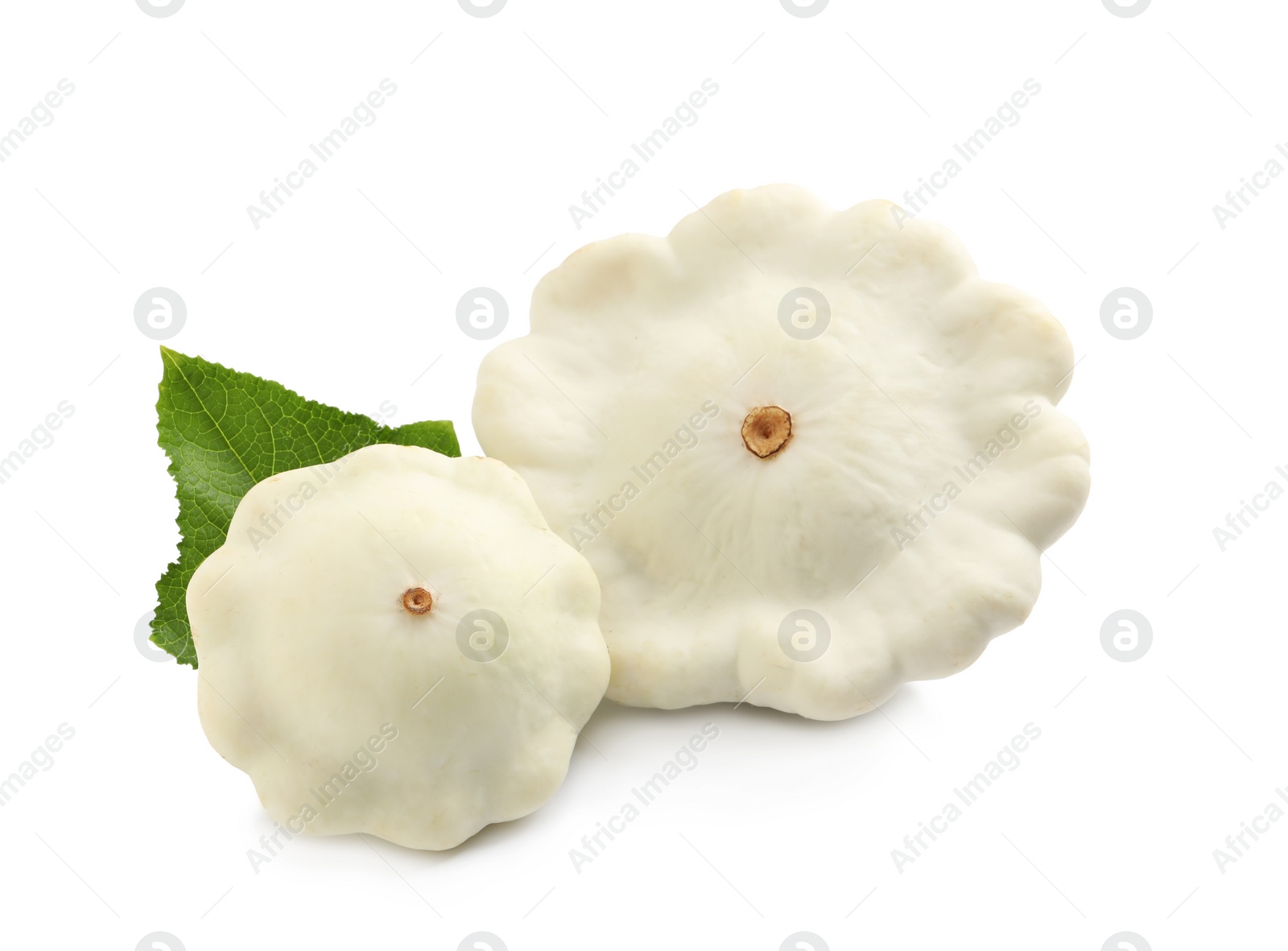 Photo of Fresh ripe pattypan squashes with leaf on white background