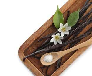 Photo of Vanilla pods, green leaves, spoon with sugar and flowers isolated on white, top view