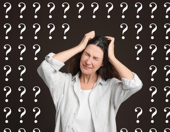 Amnesia. Confused woman and question marks on brown background
