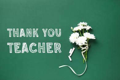Image of Phrase Thank You Teacher, beautiful flowers and chalk on green chalkboard, flat lay