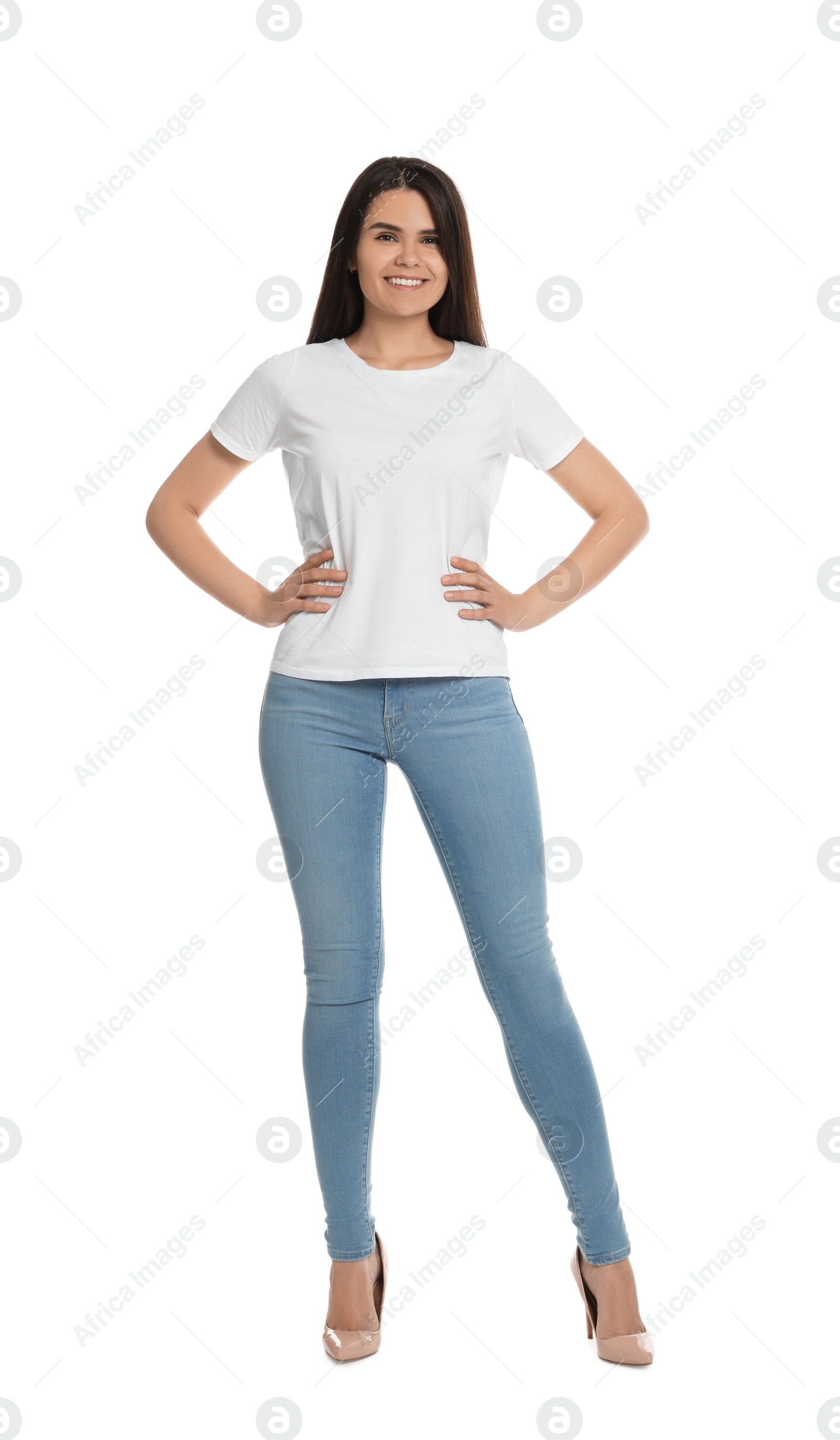 Photo of Happy woman wearing stylish light blue jeans and high heels shoes on white background