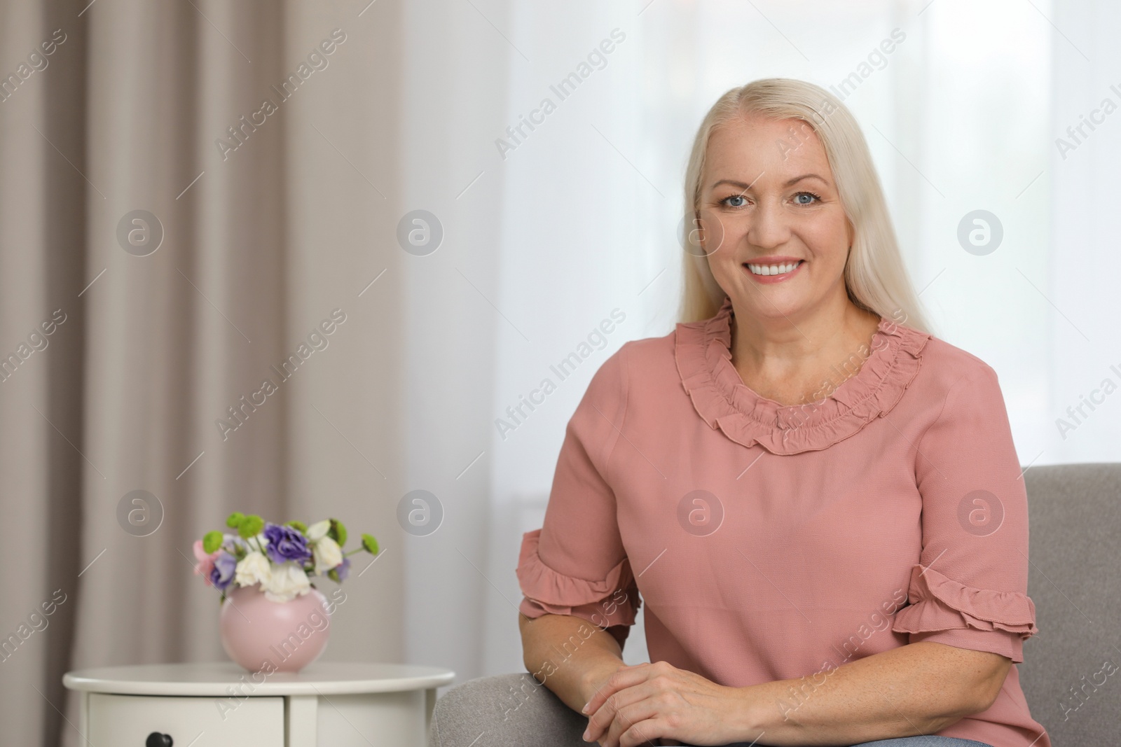 Photo of Portrait of beautiful older woman indoors with space for text