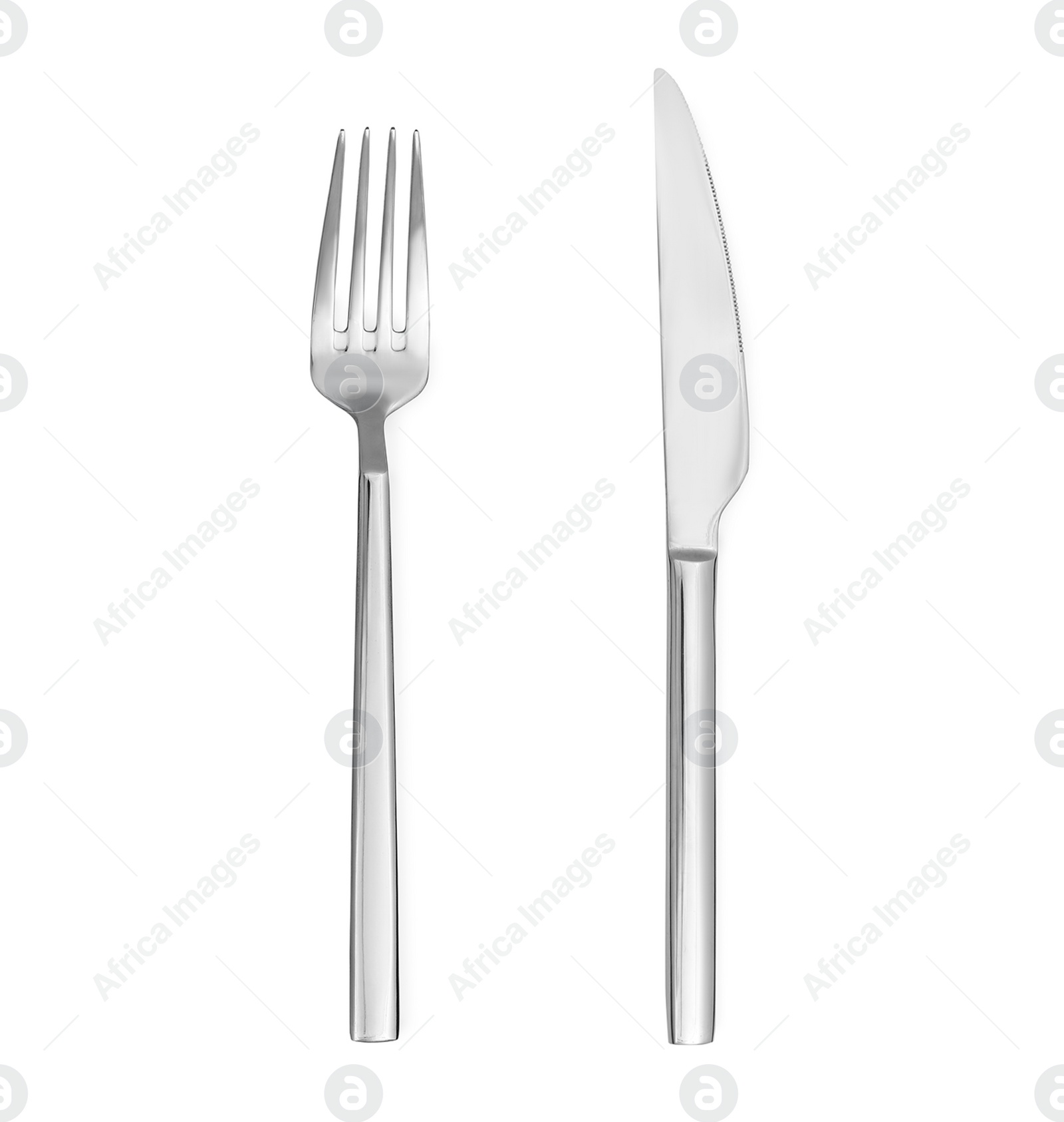 Image of Shiny silver knife and fork on white background, top view