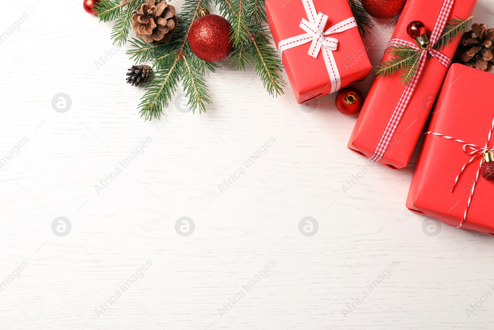 Photo of Flat lay composition with Christmas gifts on light background