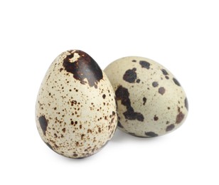 Two beautiful quail eggs on white background