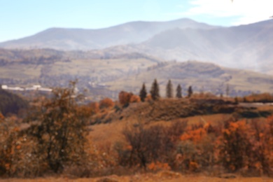 Picturesque landscape with forest and mountains, blurred view