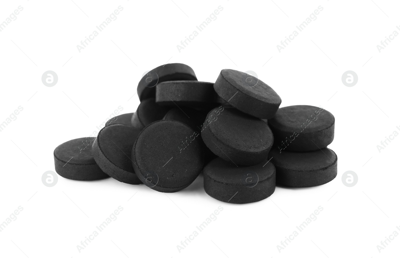 Photo of Activated charcoal pills on white background. Potent sorbent