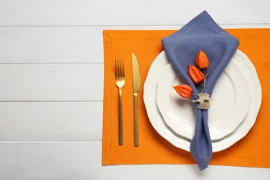 Photo of Stylish autumn table setting on white wooden background, flat lay. Space for text