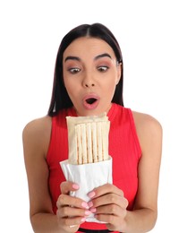 Photo of Emotional young woman with delicious shawarma on white background