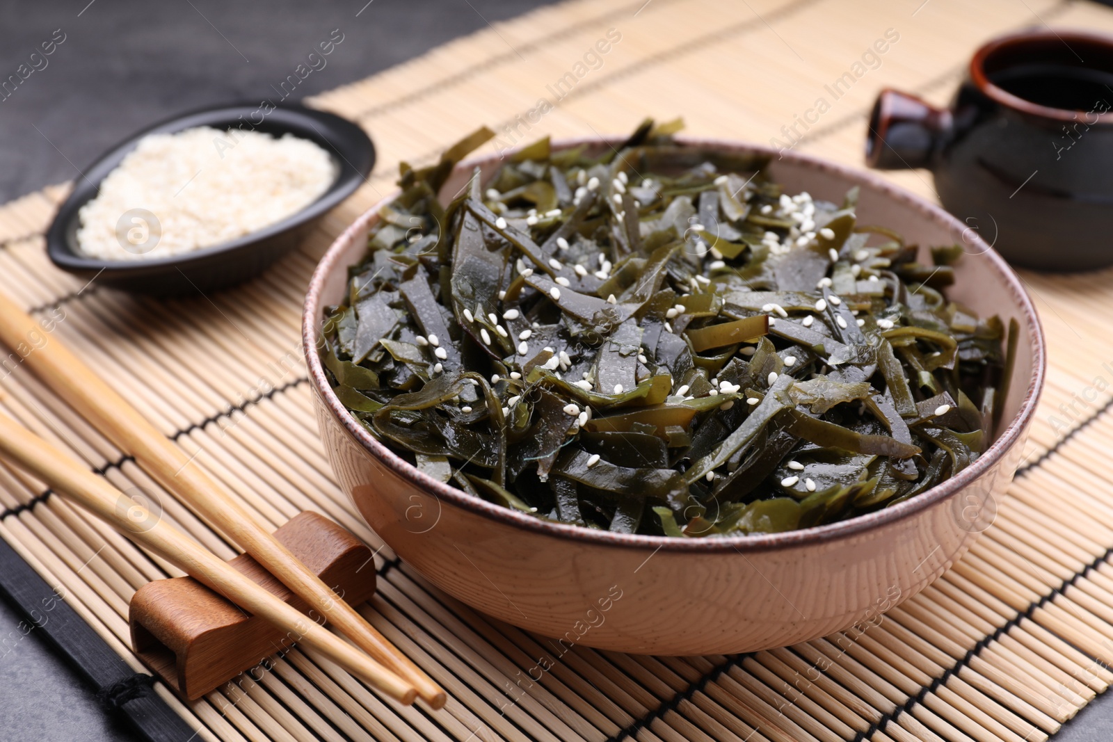 Photo of Fresh laminaria (kelp) seaweed served on table, closeup