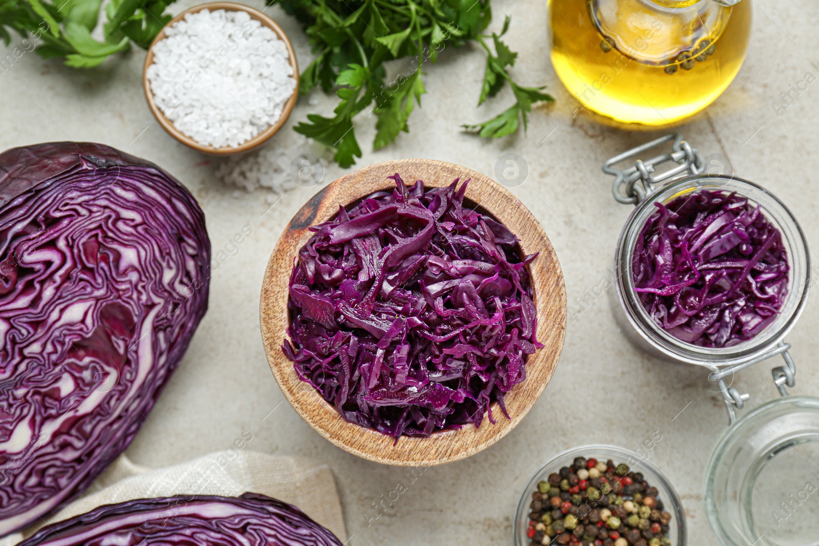 Photo of Tasty red cabbage sauerkraut and different ingredients on table, flat lay