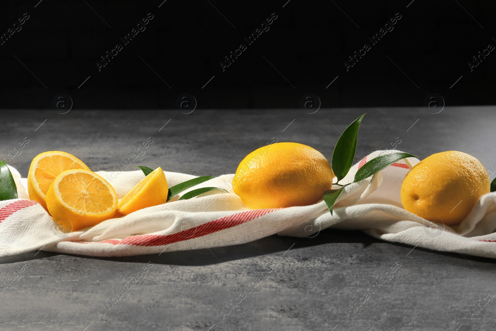 Photo of Fresh juicy lemons on table