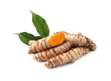 Photo of Fresh turmeric roots and green leaves isolated on white