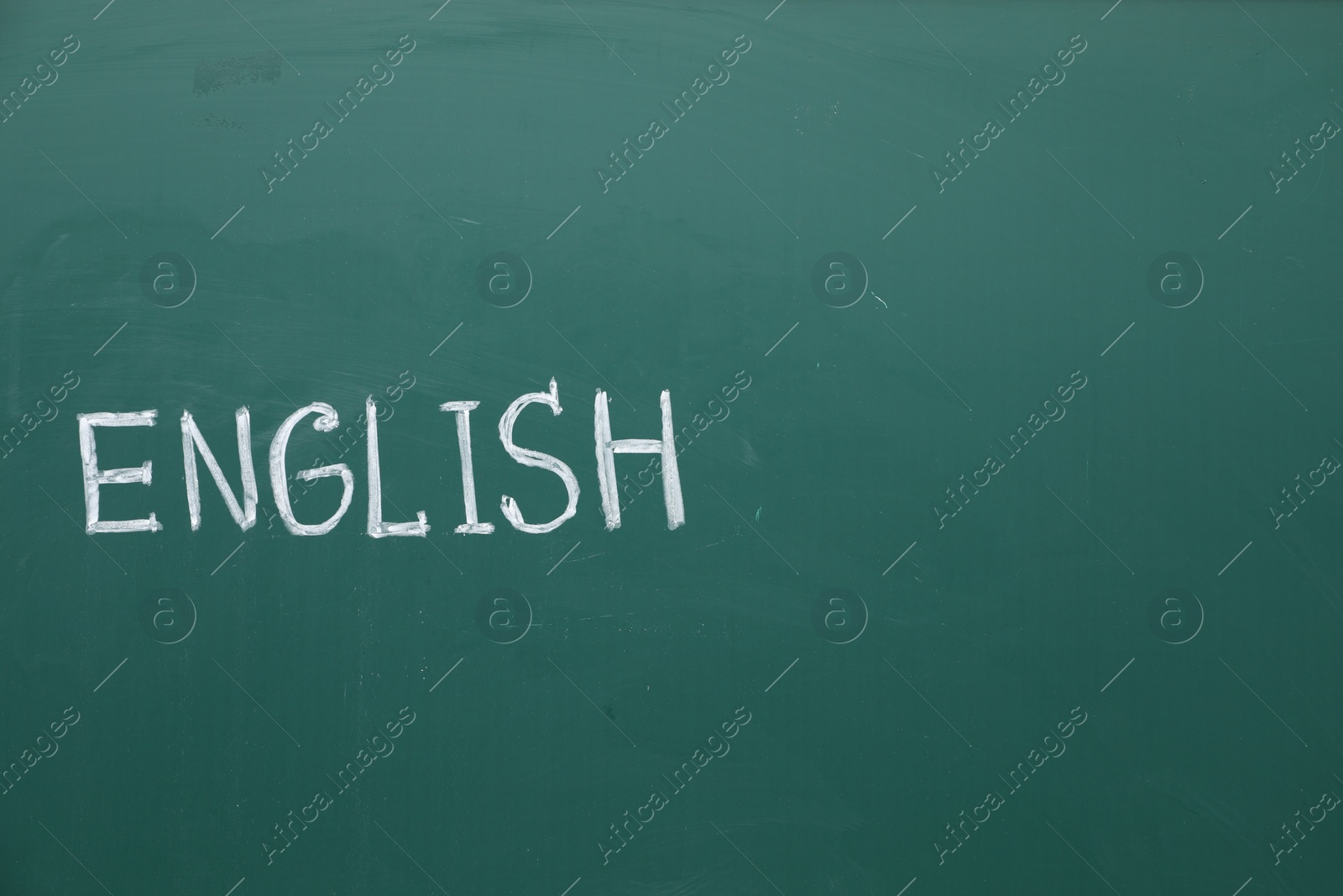 Photo of Word English written with chalk on green board. Space for text