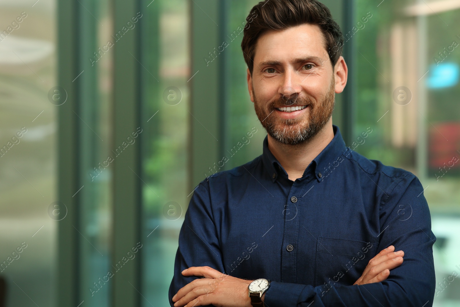 Photo of Portrait of handsome stylish man in office