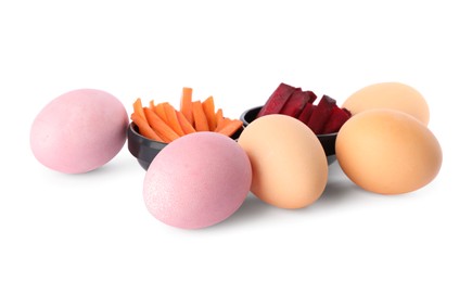 Photo of Naturally painted Easter eggs on white background. Carrot and beetroot used for coloring