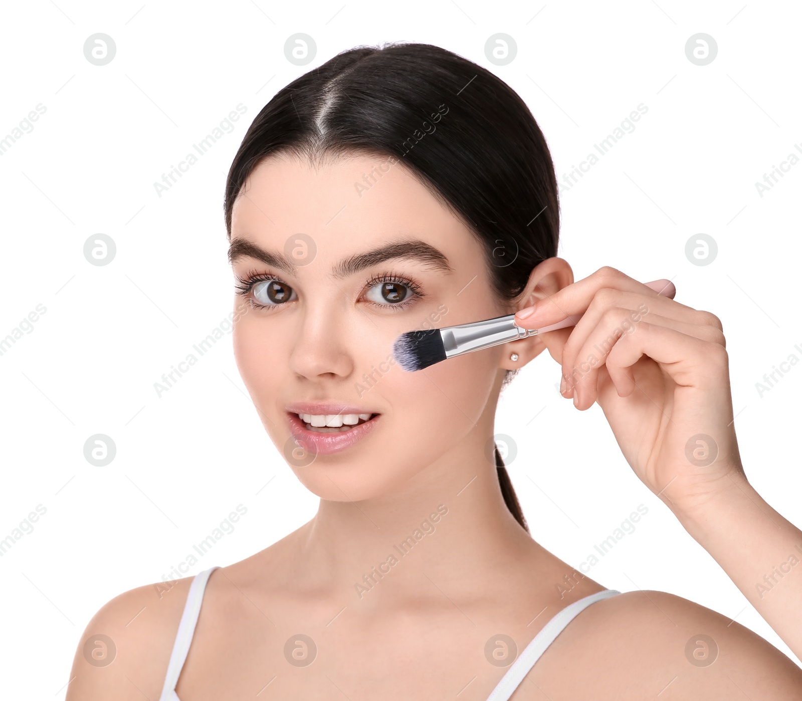 Photo of Teenage girl with makeup brush on white background
