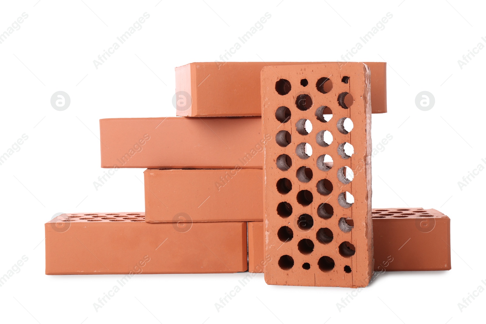 Photo of Many red bricks on white background. Building material