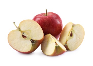 Photo of Whole and cut apples on white background