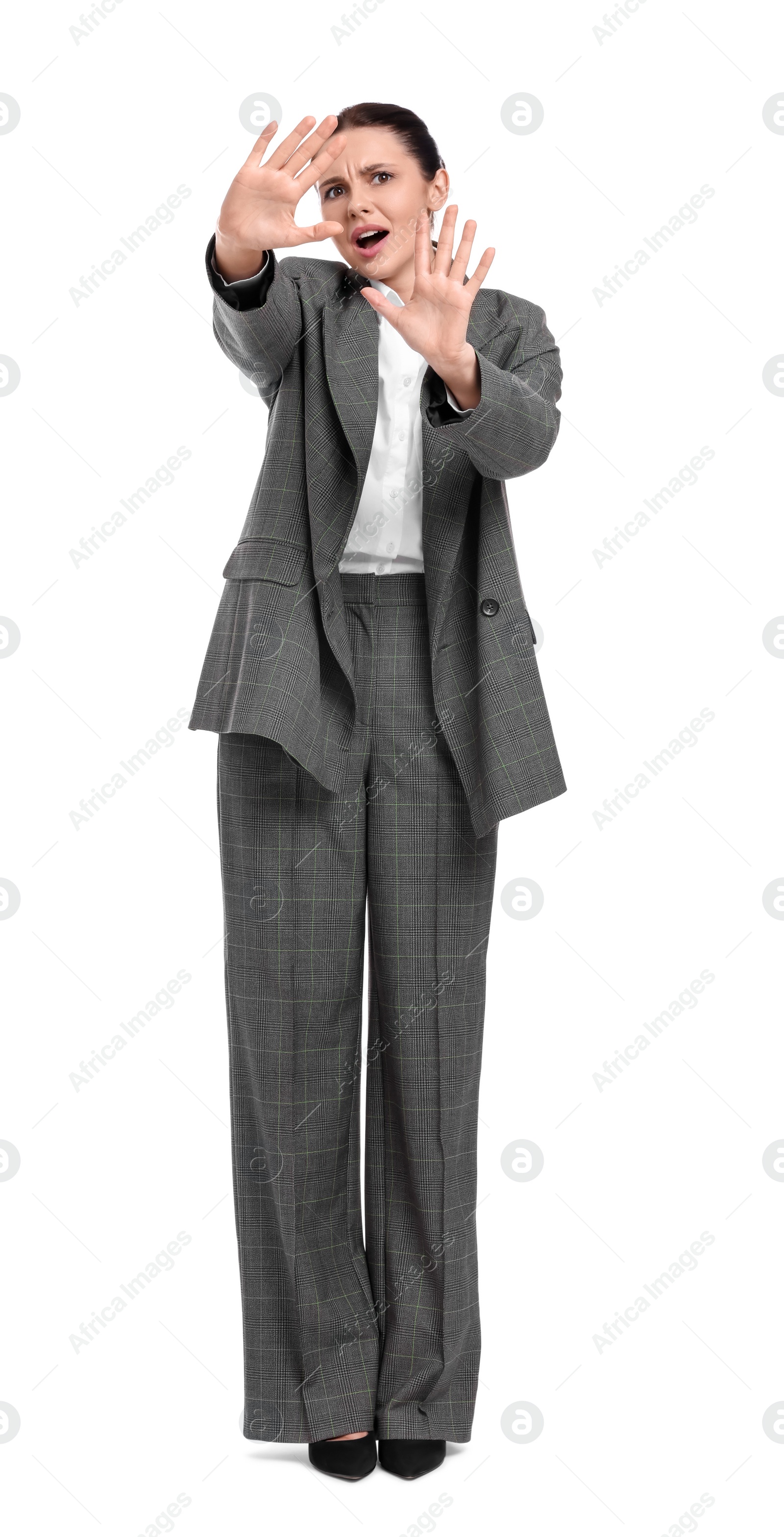 Photo of Beautiful emotional businesswoman in suit on white background