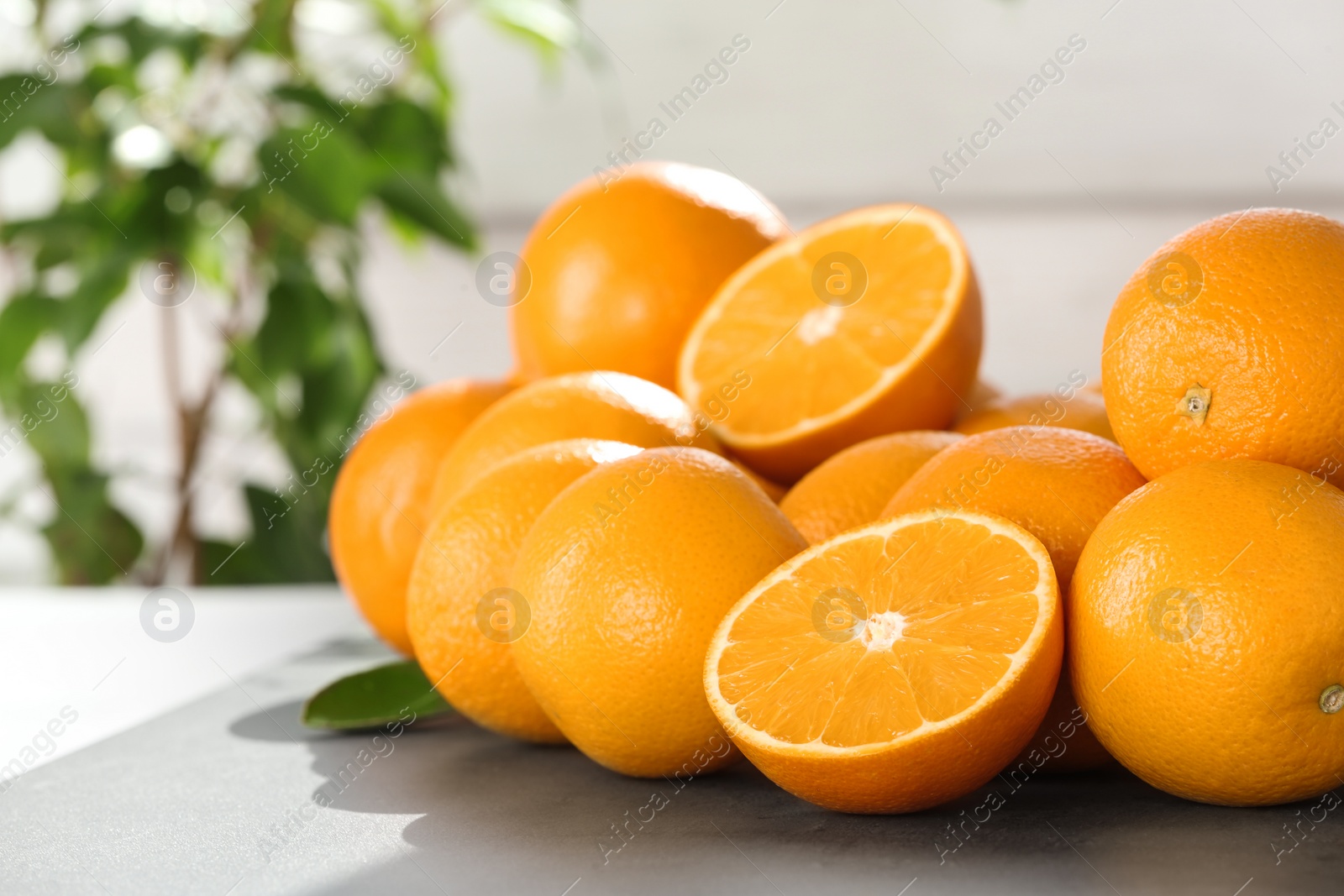 Photo of Fresh juicy oranges on table, space for text. Healthy fruits