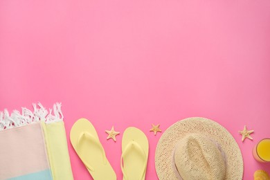 Photo of Flat lay composition with different beach objects on pink background, space for text