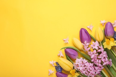 Beautiful bouquet with different flowers on yellow background, flat lay. Space for text