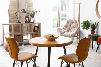 Modern dining room interior with table and chairs